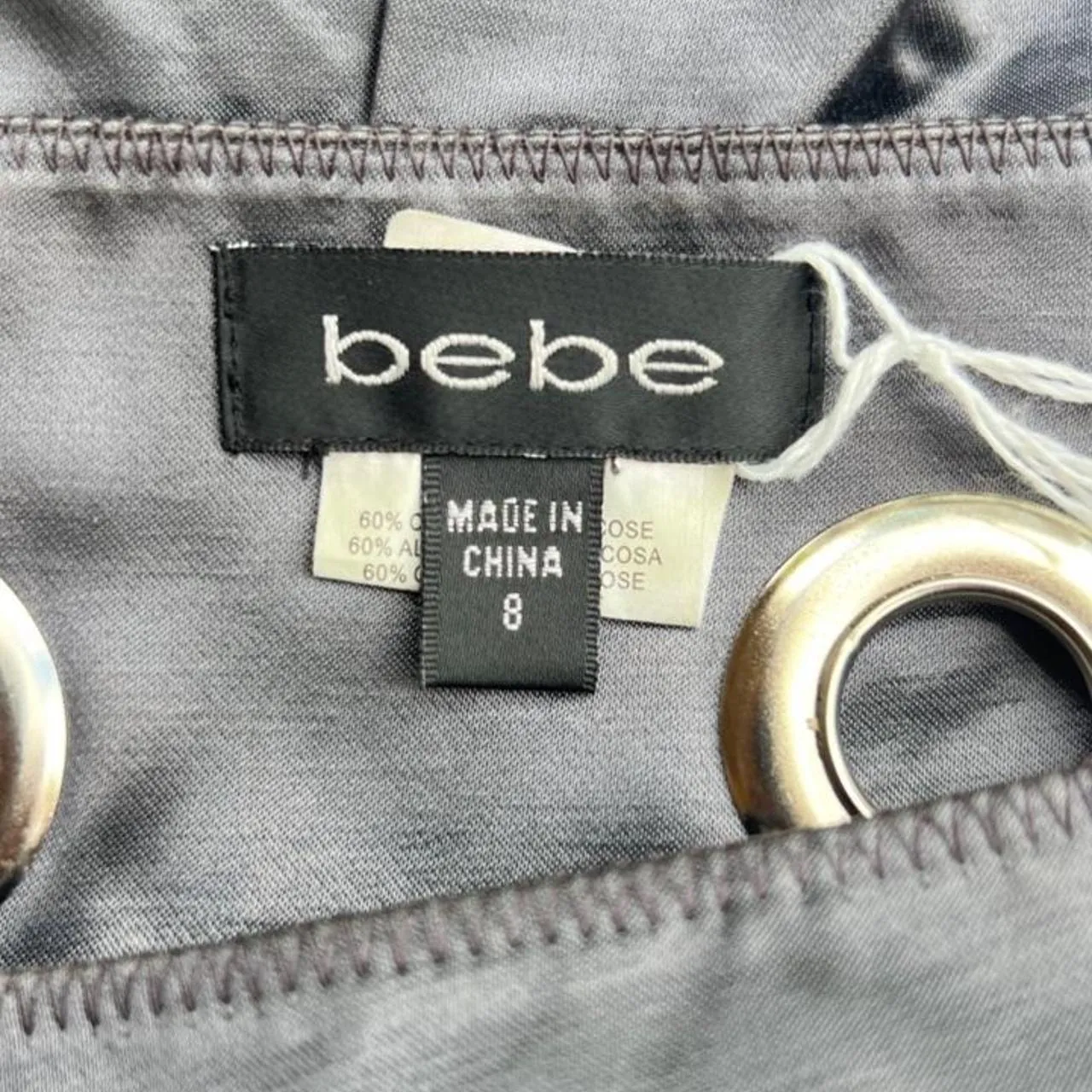 Vintage Bebe Silver Satin Mettalic Pleated Mini Skirt with Grommet Details, photo 4 of 4
